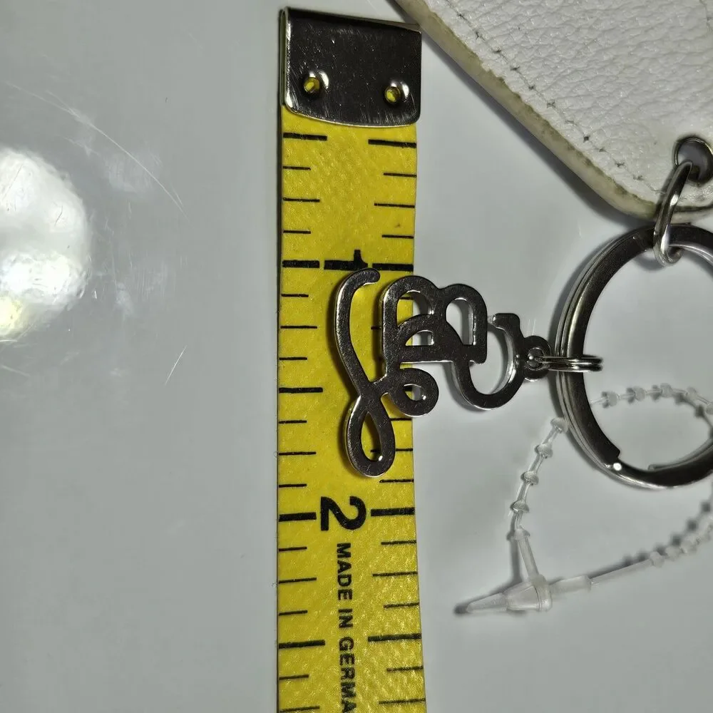 Santa Barbara Design Studio Silver Tone White Leather Tired As A Mother Keychain